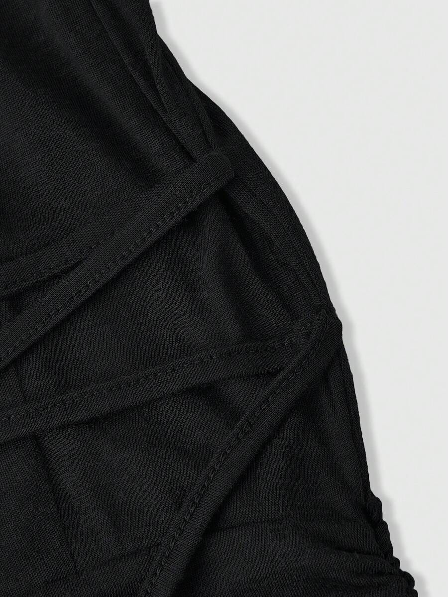 Front view of a sleeveless hooded cowl neck bodycon mini dress with draped collar detailing in knitted fabric.