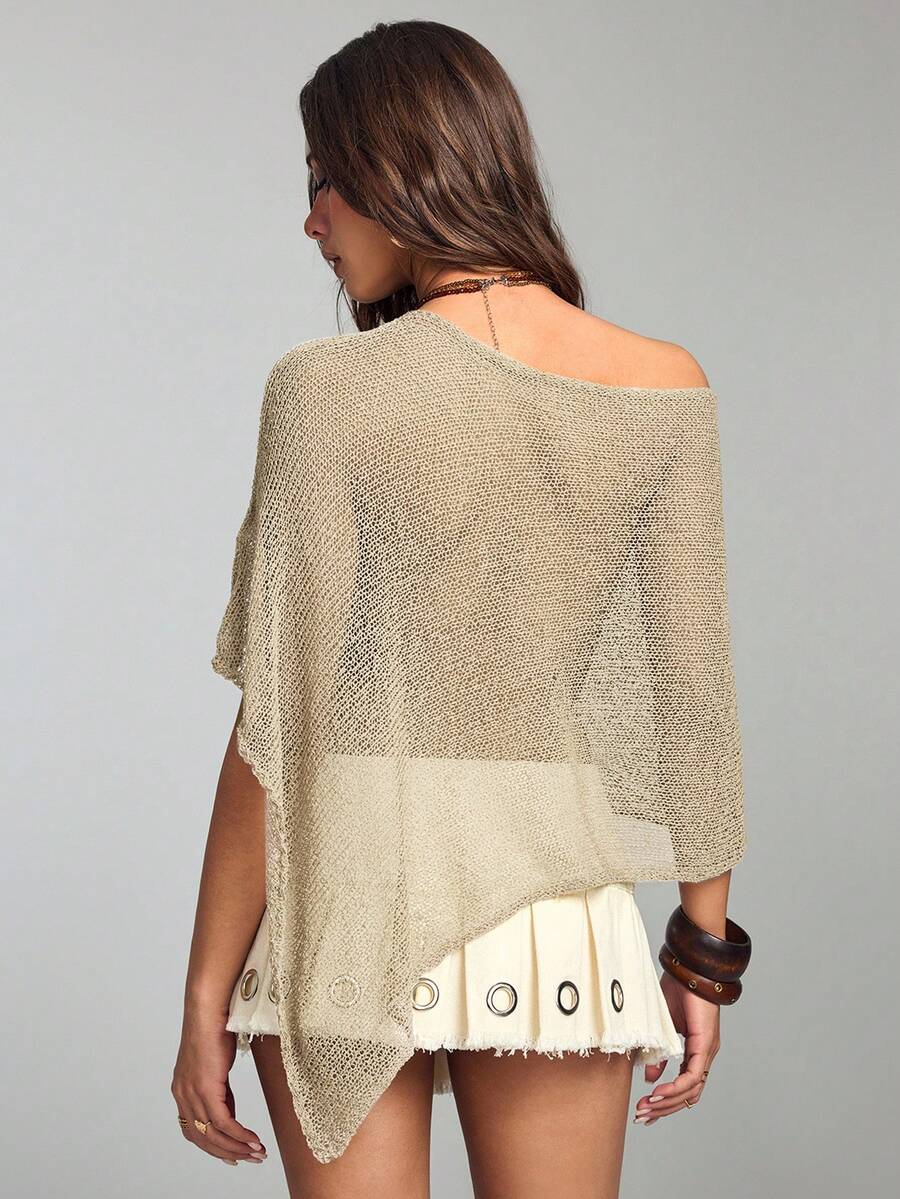 Women's casual hollow knit poncho top with boat neck, cloak sleeves, and asymmetrical hem