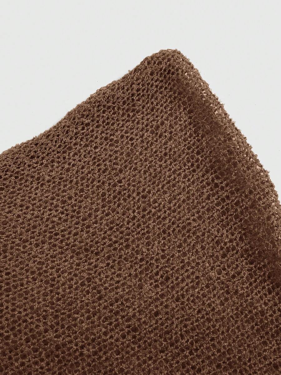 Women's casual hollow knit poncho top with boat neck, cloak sleeves, and asymmetrical hem