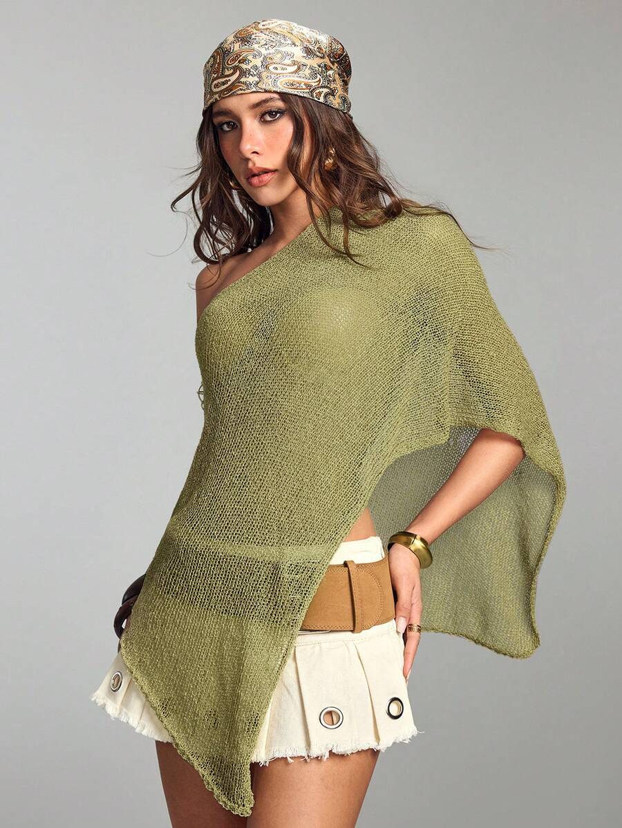 Women's casual hollow knit poncho top with boat neck, cloak sleeves, and asymmetrical hem