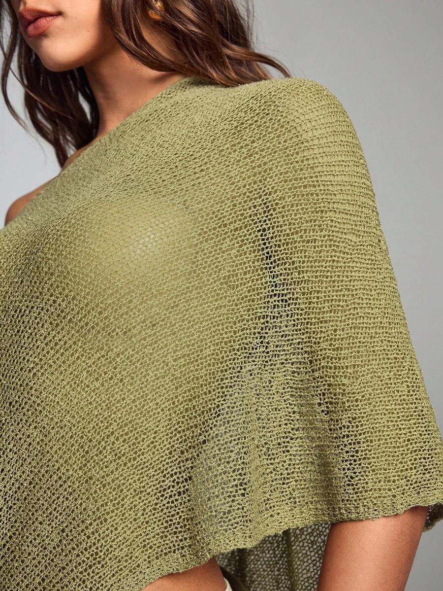 Women's casual hollow knit poncho top with boat neck, cloak sleeves, and asymmetrical hem