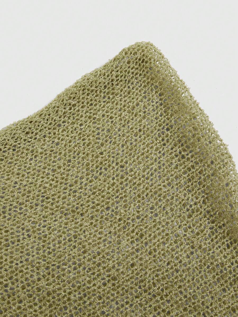 Women's casual hollow knit poncho top with boat neck, cloak sleeves, and asymmetrical hem