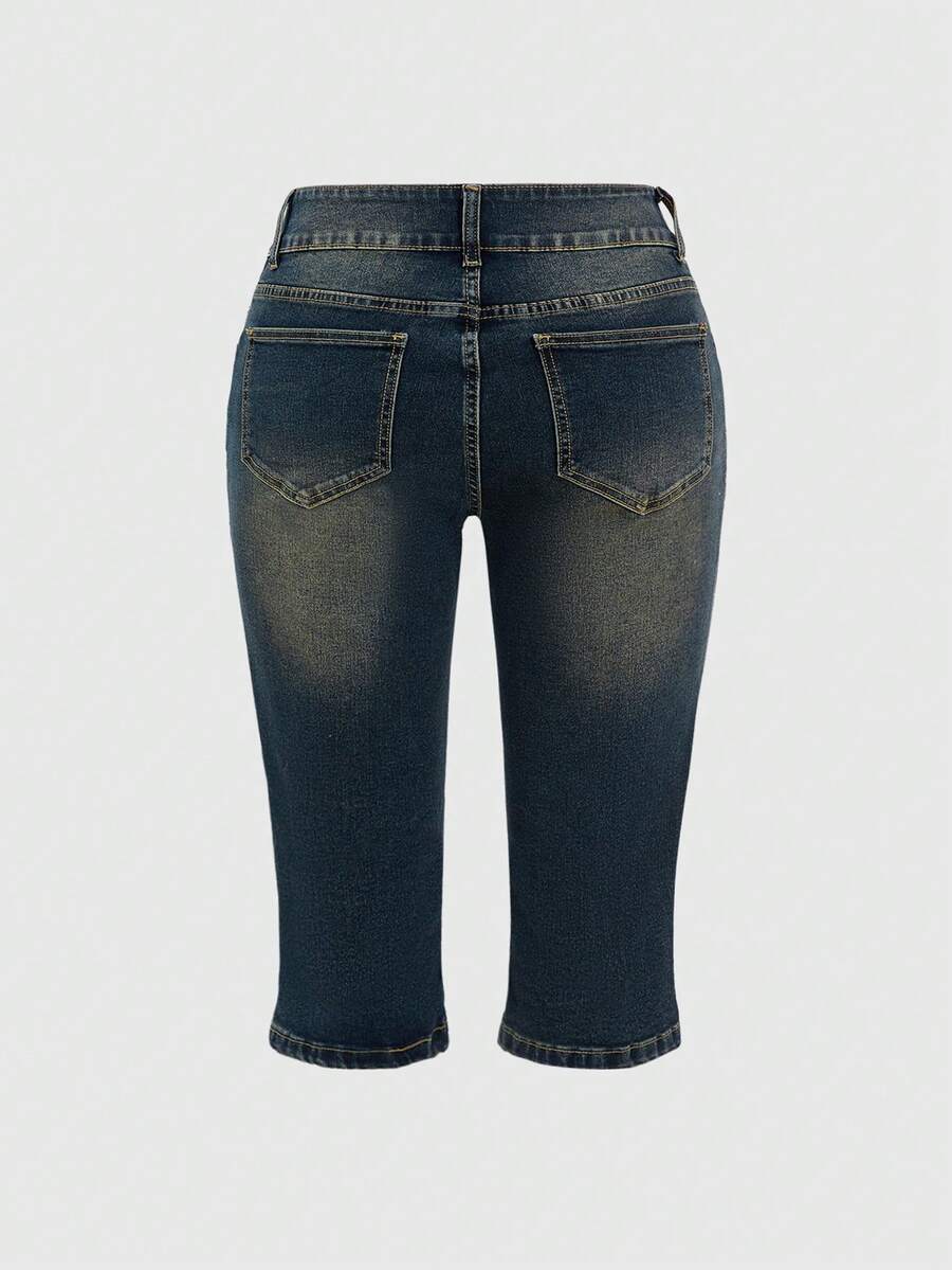 Women's ultra low-rise skinny denim shorts featuring sparkling gold rhinestone embellishments with front pockets and zipper fly.