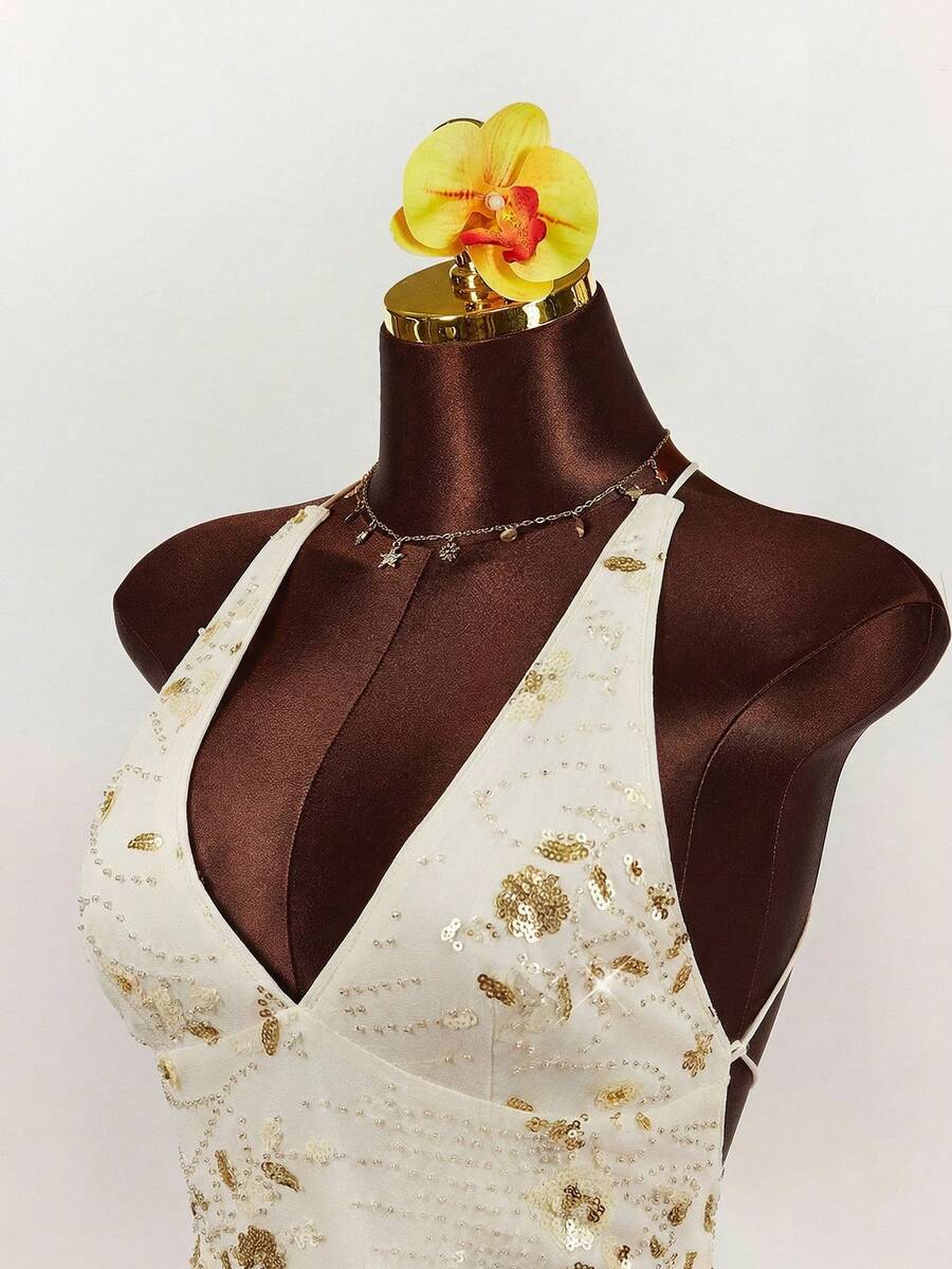 Women's embroidered sequin halter cami top featuring a deep V-neck, backless party design, and slim fit silhouette.