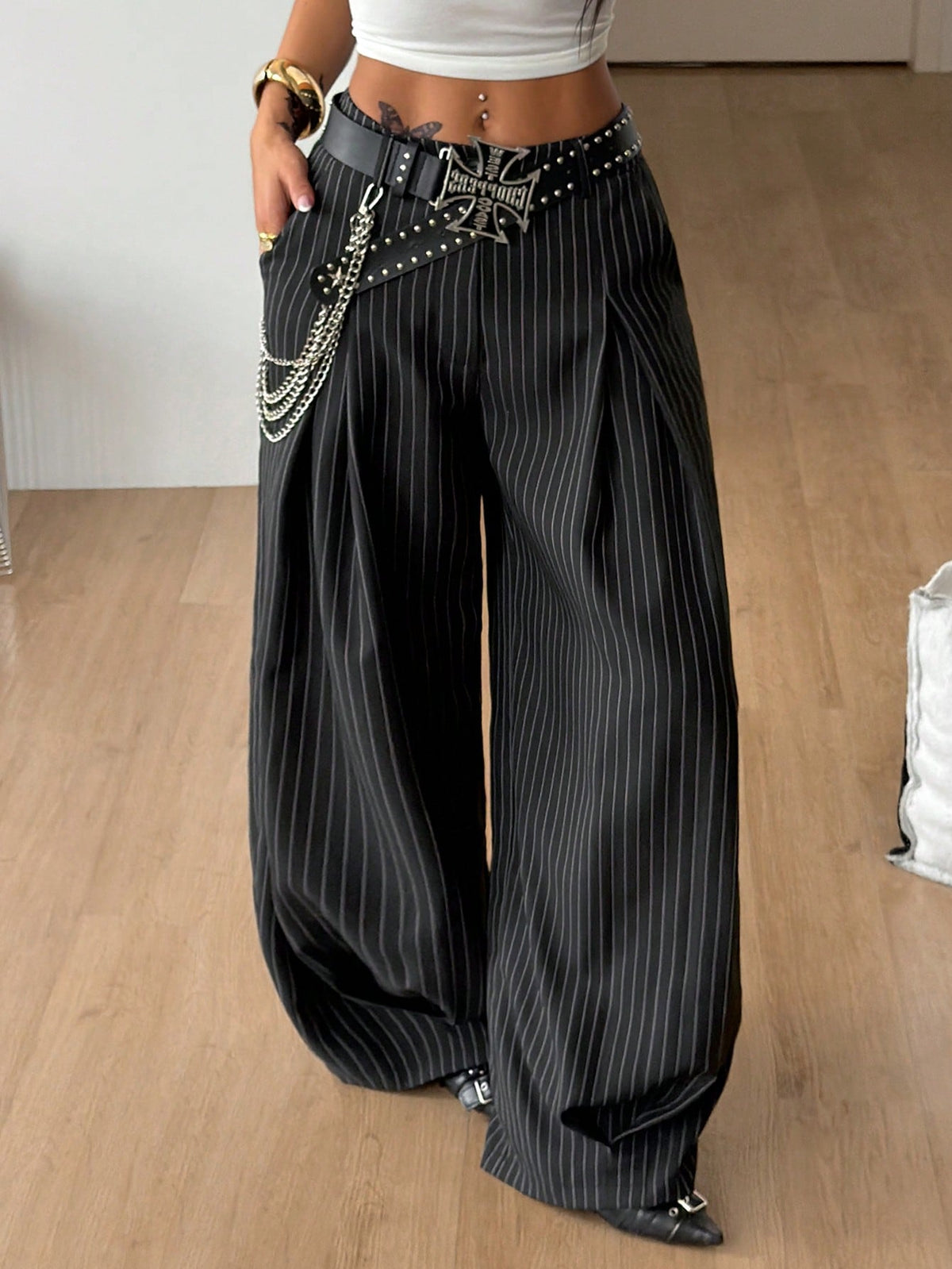 Casual black striped woven long pants for women featuring a low waist and loose fit design.