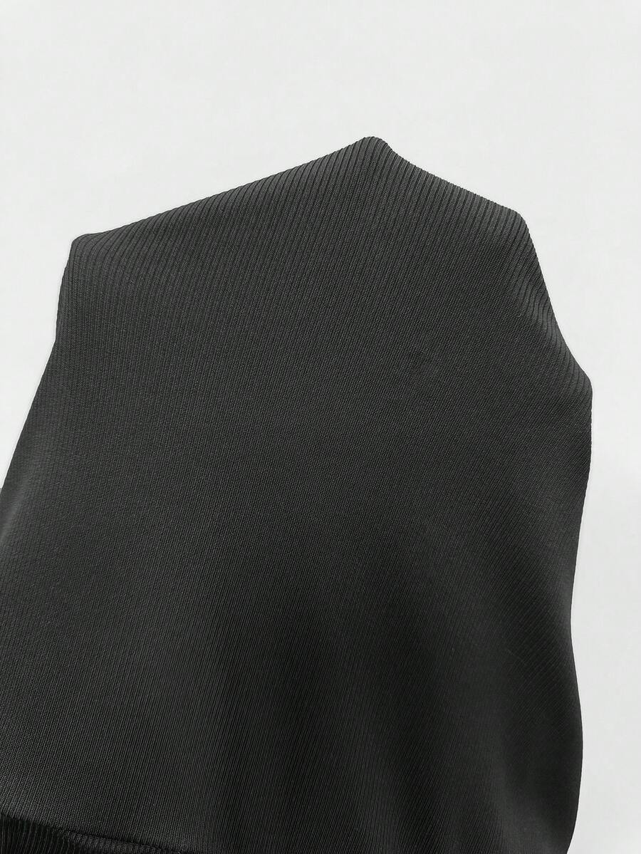 Women's black studded mini shorts crafted from stretch knitted fabric featuring an elastic waistband and skinny fit.