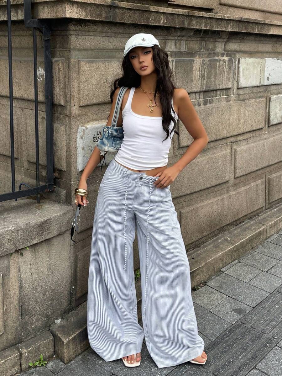 Women's casual straight leg striped woven pants featuring a low waist and zipper fly closure.