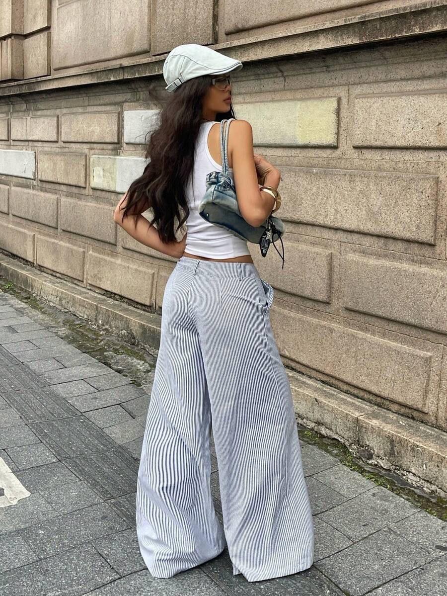 Women's casual straight leg striped woven pants featuring a low waist and zipper fly closure.