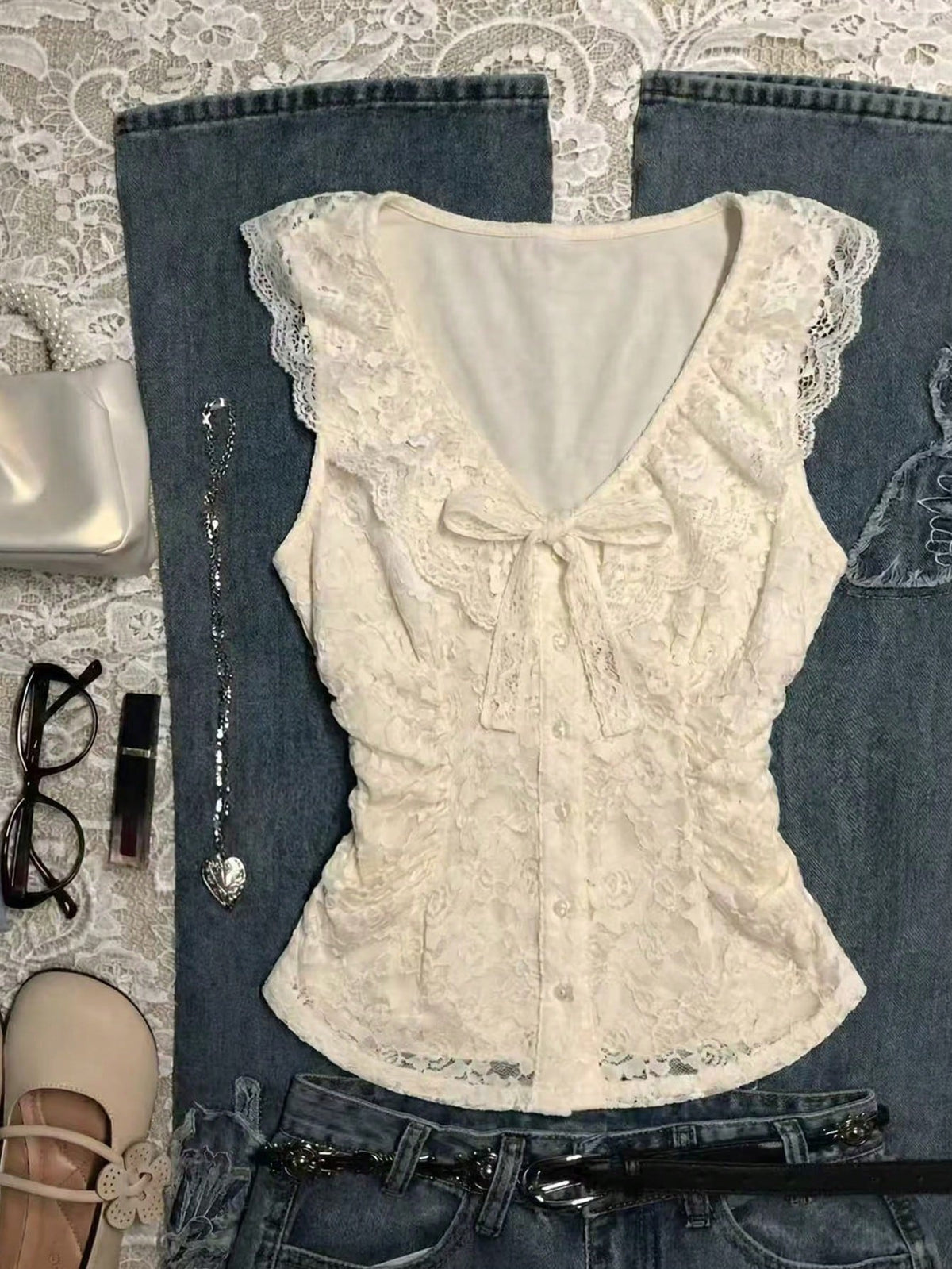 Franclia women's slim fit V-neck sleeveless tank top featuring lace patchwork detailing and a bow accent.