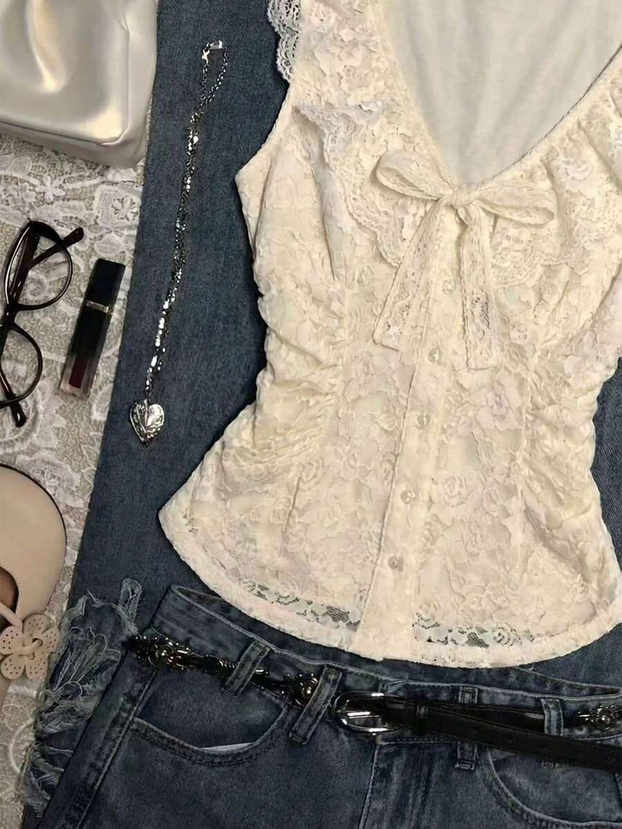 Franclia women's slim fit V-neck sleeveless tank top featuring lace patchwork detailing and a bow accent.