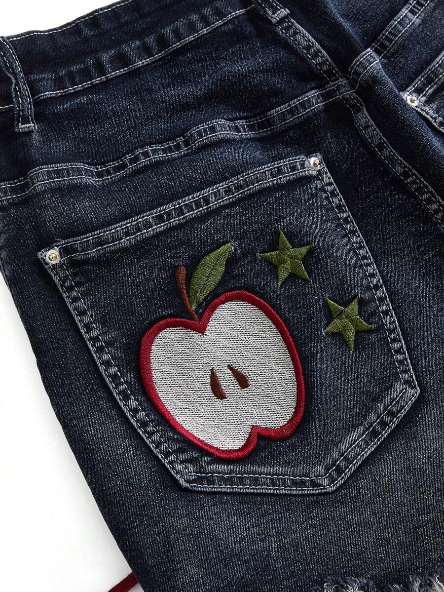 Plus size black gothic mini shorts with heart embroidery, graphic pocket pattern, lace-up detail, raw hem, and zipper fly