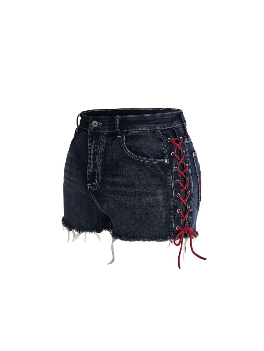 Plus size black gothic mini shorts with heart embroidery, graphic pocket pattern, lace-up detail, raw hem, and zipper fly