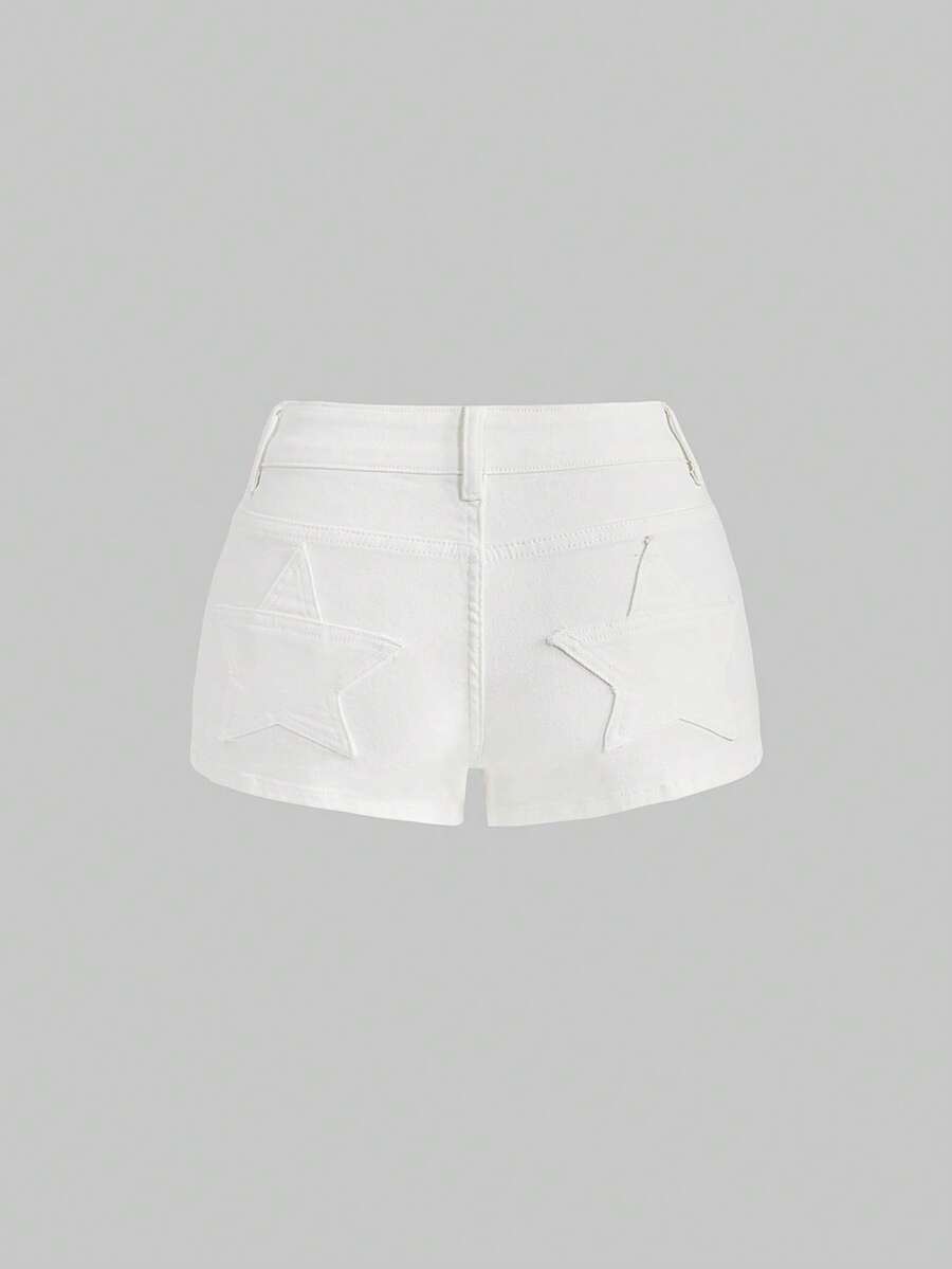 Women's ultra low waist mini shorts with back pockets, zipper fly, button detail, random print, and star patch in a grunge punk Y2K style.