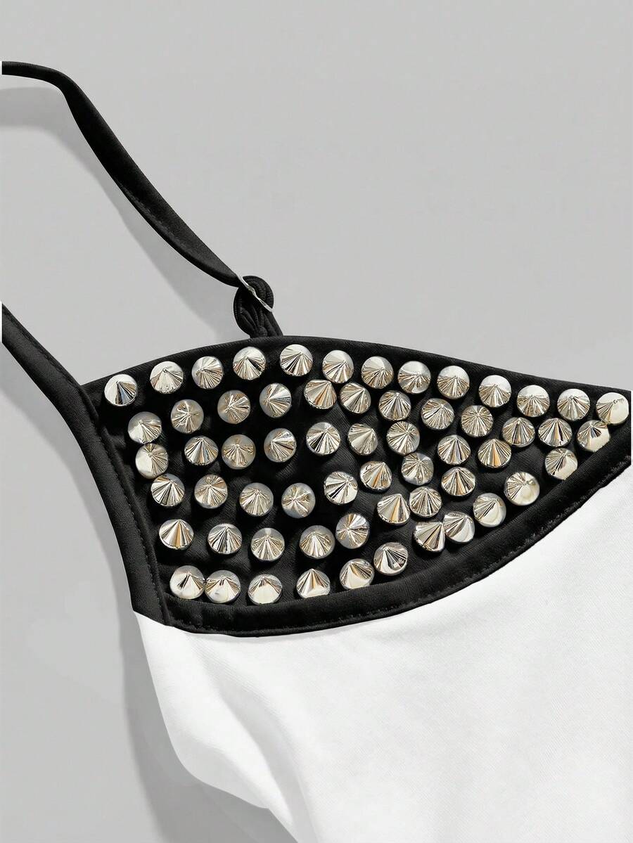 Women's slim fit sleeveless crop top featuring spaghetti straps, ruched detailing, and studded rhinestone accents.