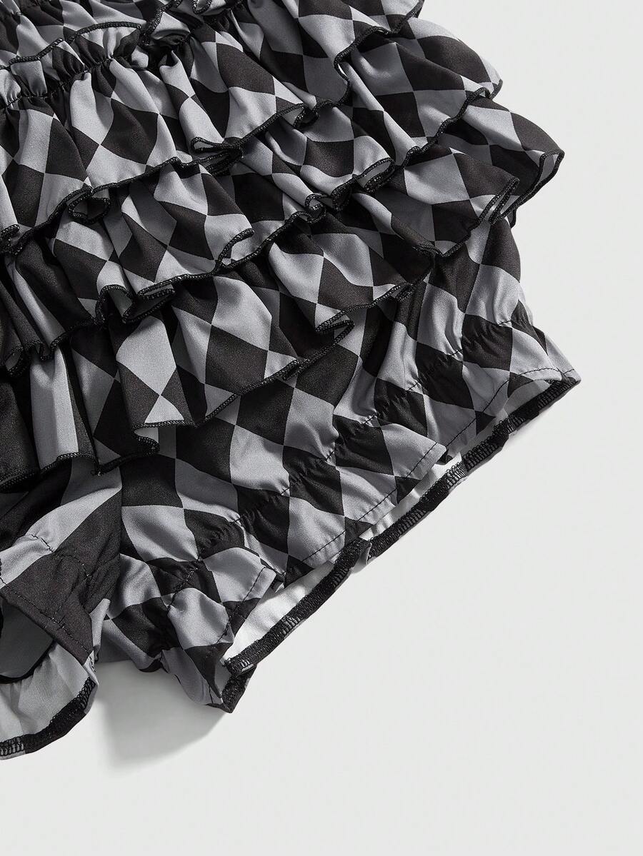 Women's gothic patchwork pumpkin shorts with tiered ruffle hem and geometric striped plaid pattern.