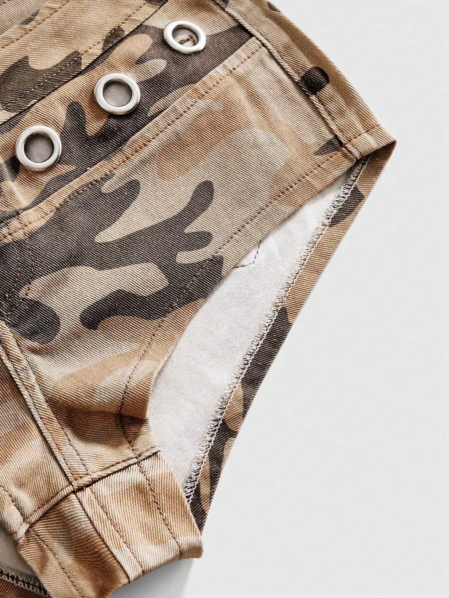 Women's ultra low waist camouflage mini skort shorts with zipper fly, button detail, and grommet eyelet accents.