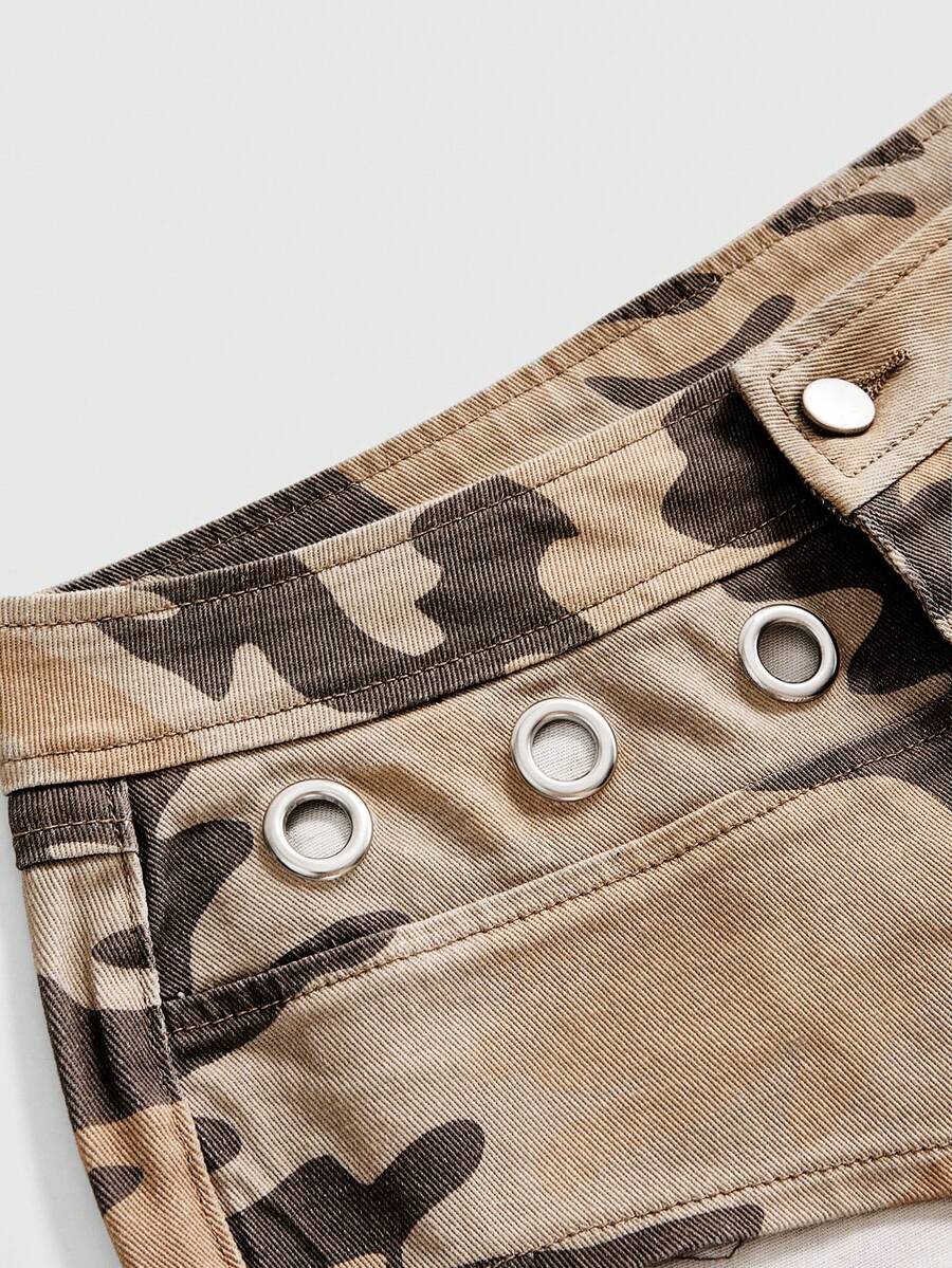 Women's ultra low waist camouflage mini skort shorts with zipper fly, button detail, and grommet eyelet accents.