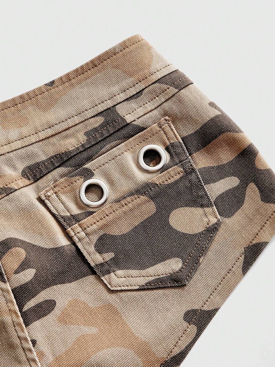 Women's ultra low waist camouflage mini skort shorts with zipper fly, button detail, and grommet eyelet accents.