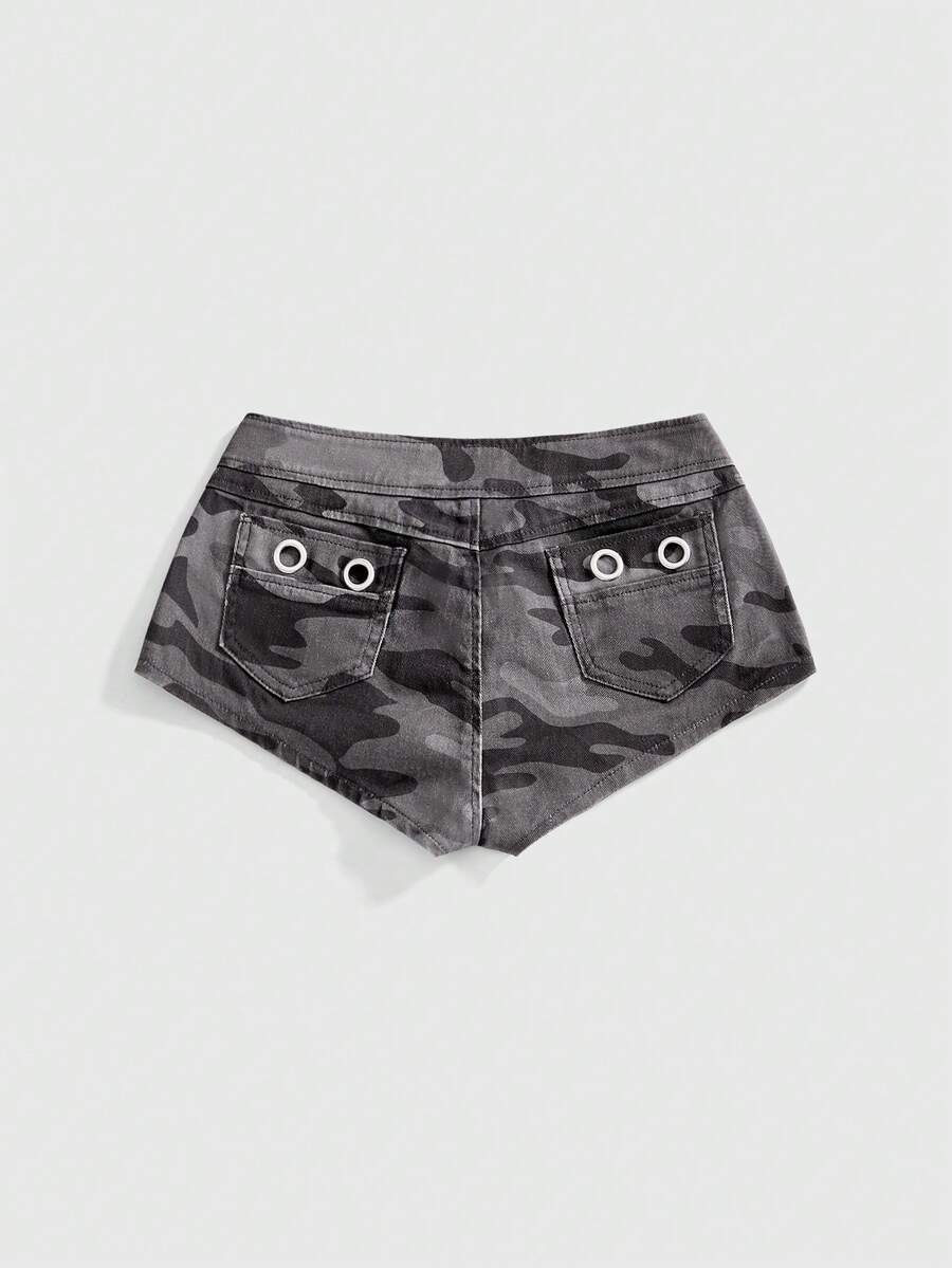 Women's ultra low waist camouflage mini skort shorts with zipper fly, button detail, and grommet eyelet accents.