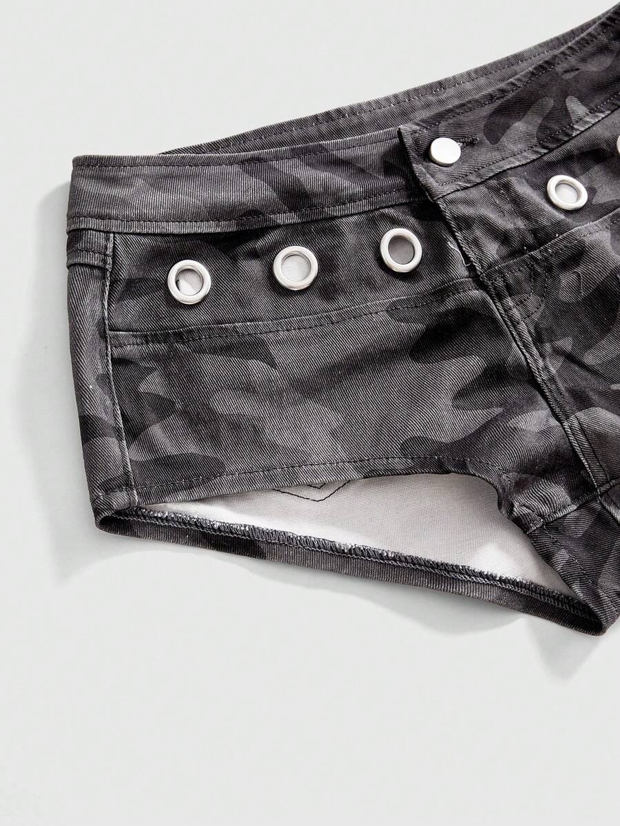 Women's ultra low waist camouflage mini skort shorts with zipper fly, button detail, and grommet eyelet accents.