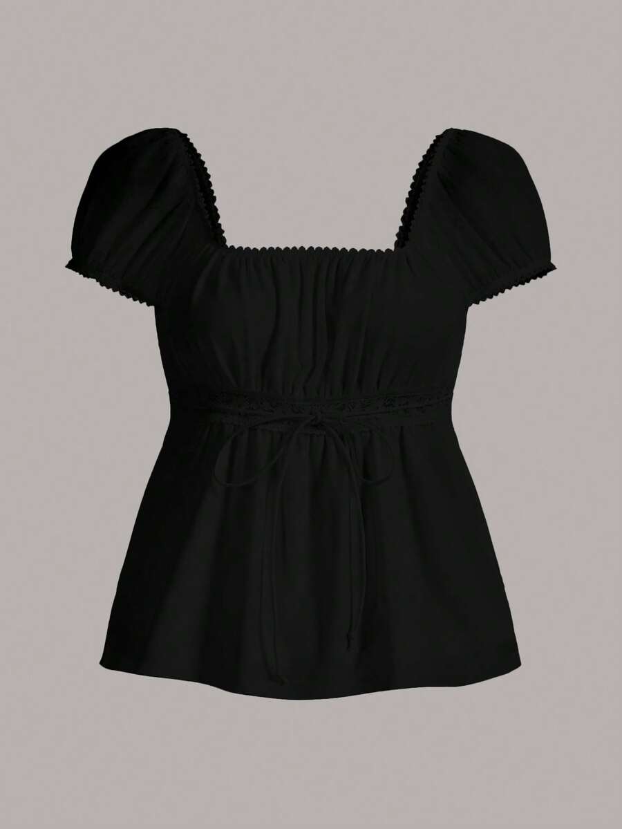 Women's black short puff sleeve top featuring a square neckline, ruched bust detail, and flared ruffle hem.