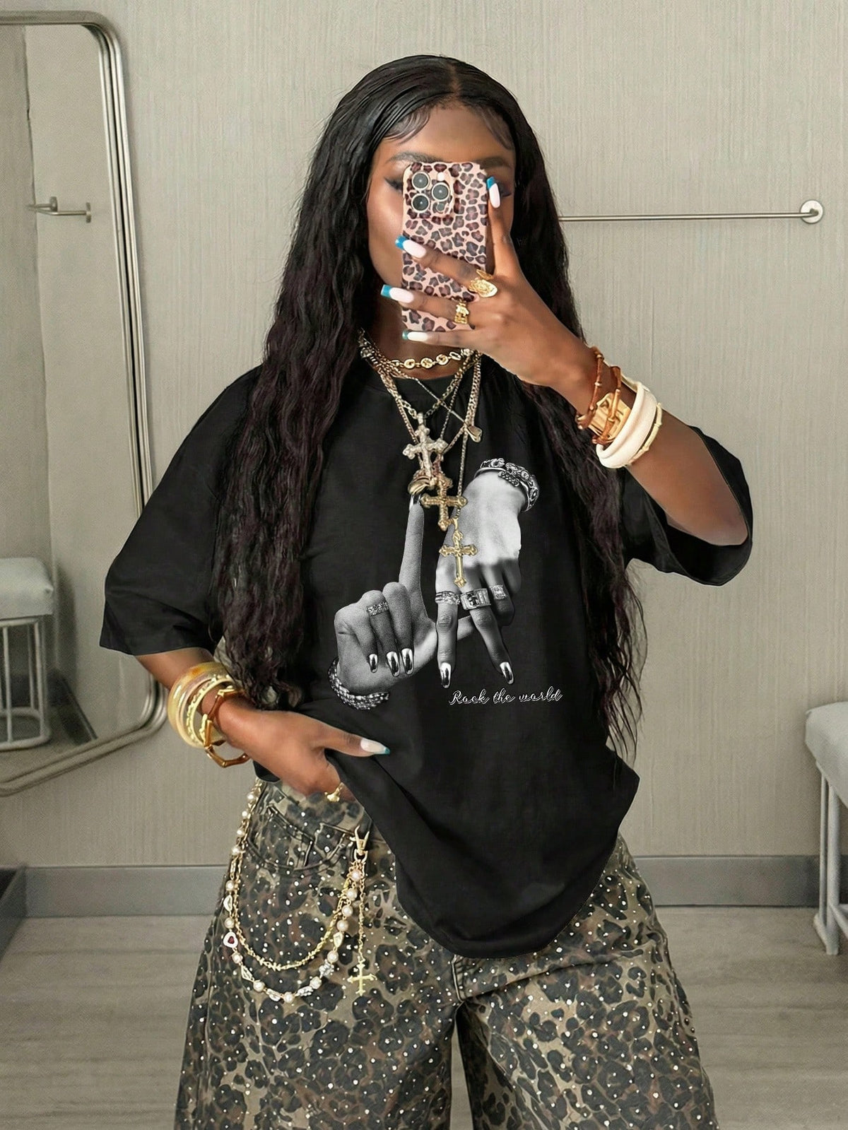 Women's oversized graphic crew neck t-shirt made of 100% white cotton knitted fabric with drop shoulder half sleeves.
