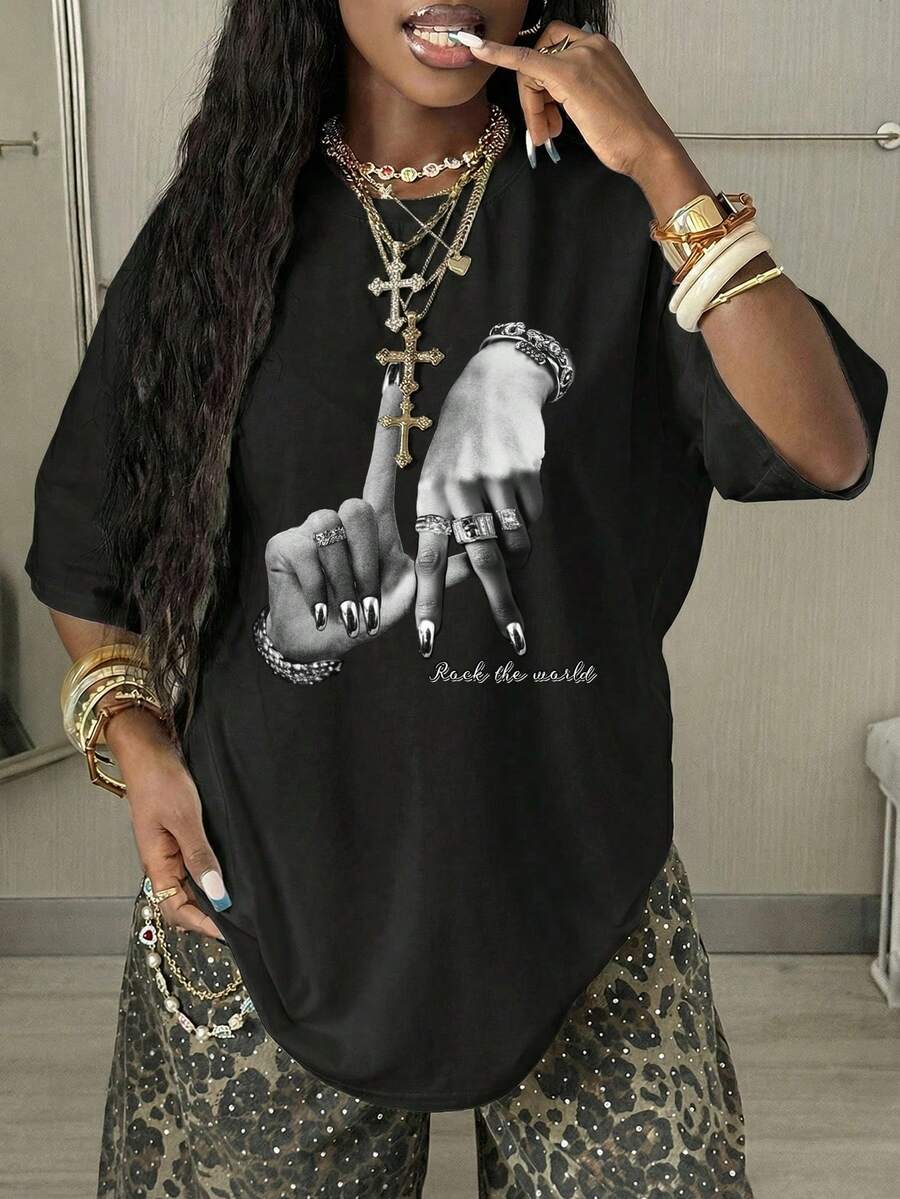 Women's oversized graphic crew neck t-shirt made of 100% white cotton knitted fabric with drop shoulder half sleeves.
