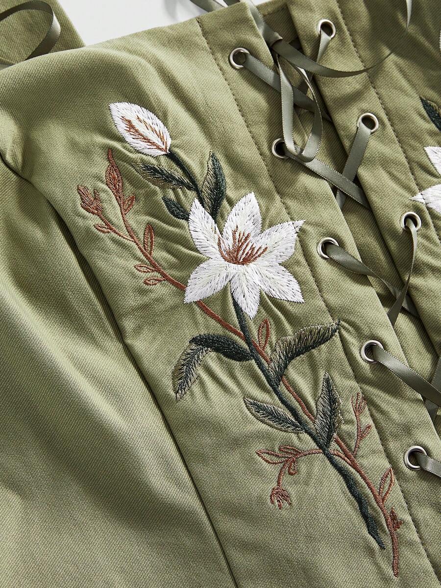 Green plus size floral embroidered camisole crop top featuring lace-up eyelets and an asymmetrical hem.