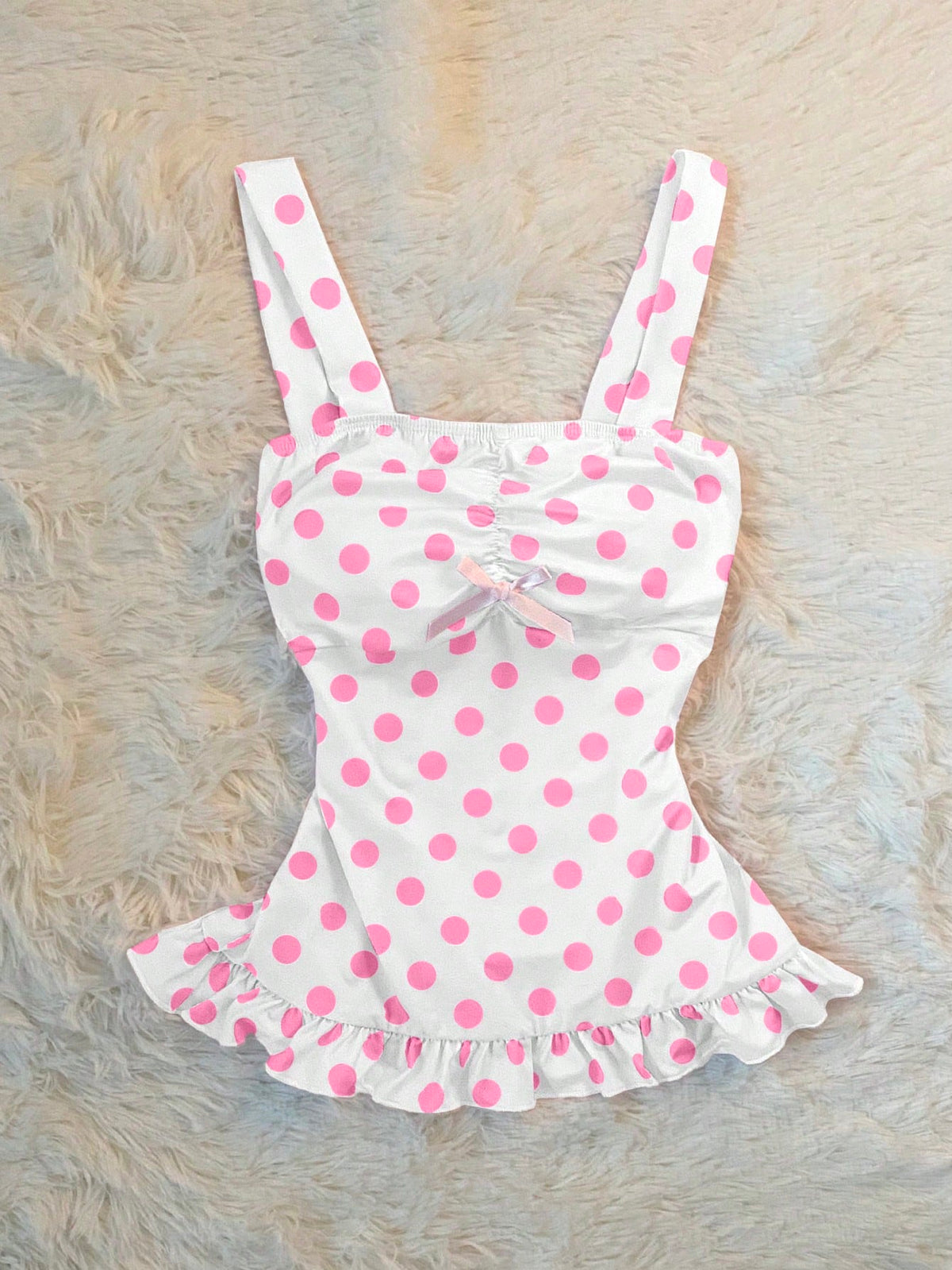 Women's retro slim-fit crop top featuring wide straps, ruched shirred detailing, asymmetrical ruffle hem, and cute bow accent.
