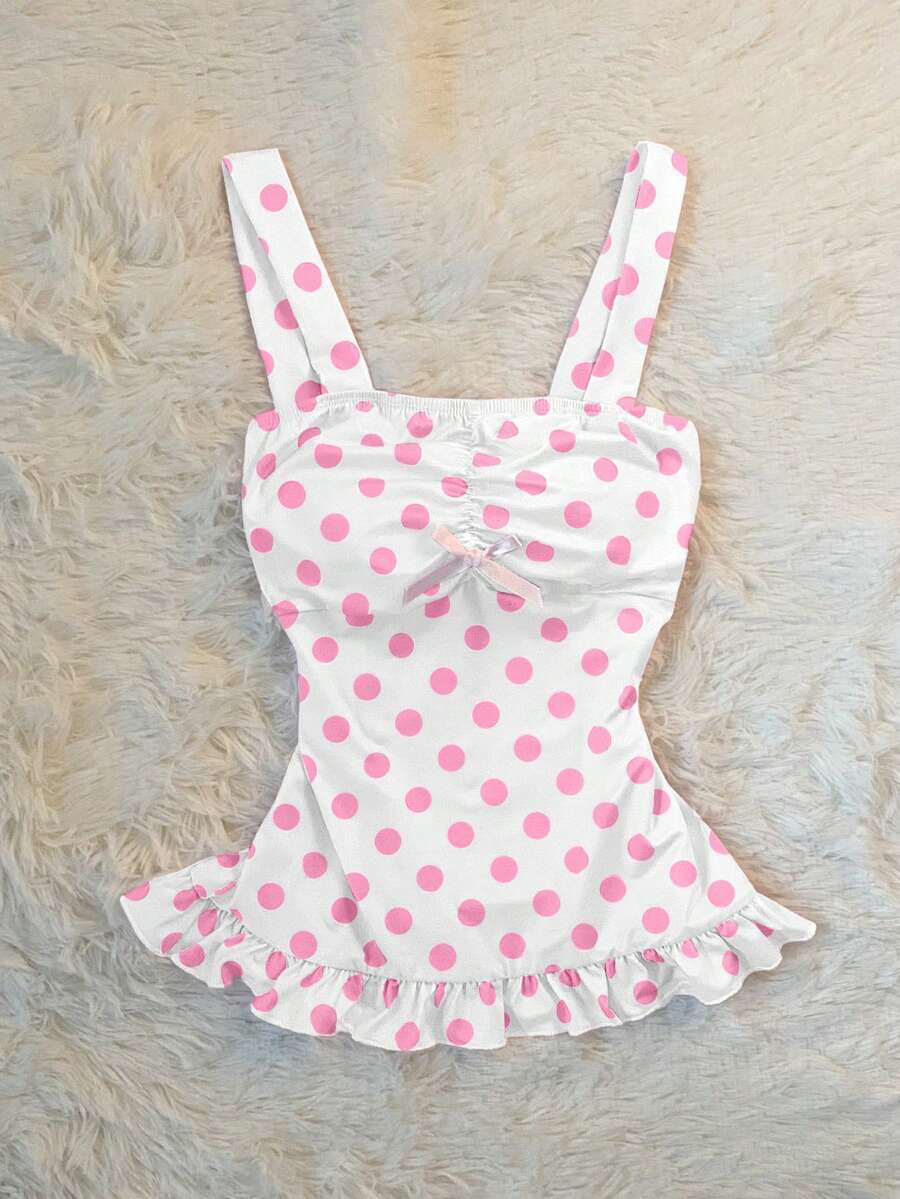 Women's retro slim-fit crop top featuring wide straps, ruched shirred detailing, asymmetrical ruffle hem, and cute bow accent.