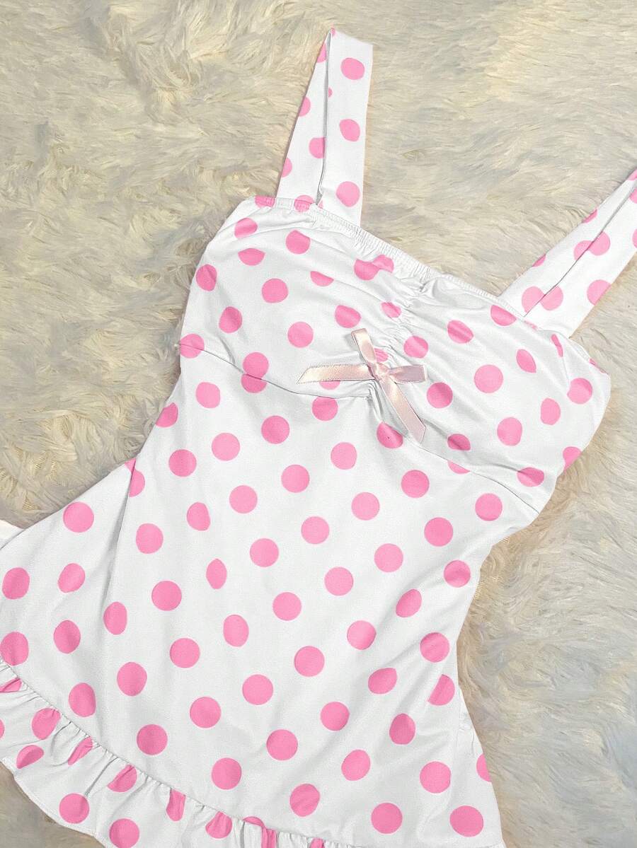 Women's retro slim-fit crop top featuring wide straps, ruched shirred detailing, asymmetrical ruffle hem, and cute bow accent.