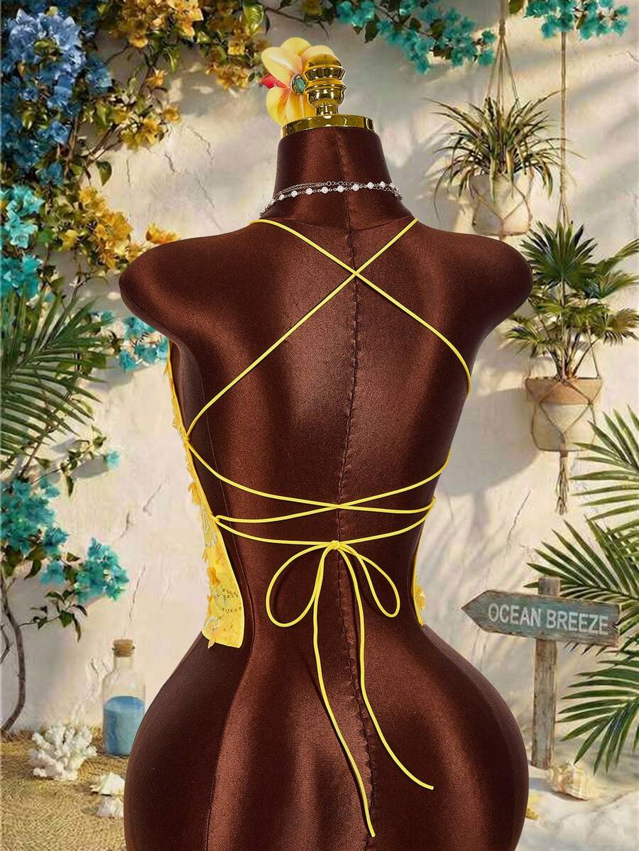 Women's embroidered sequin halter cami top featuring a deep V-neck, backless party design, and slim fit silhouette.