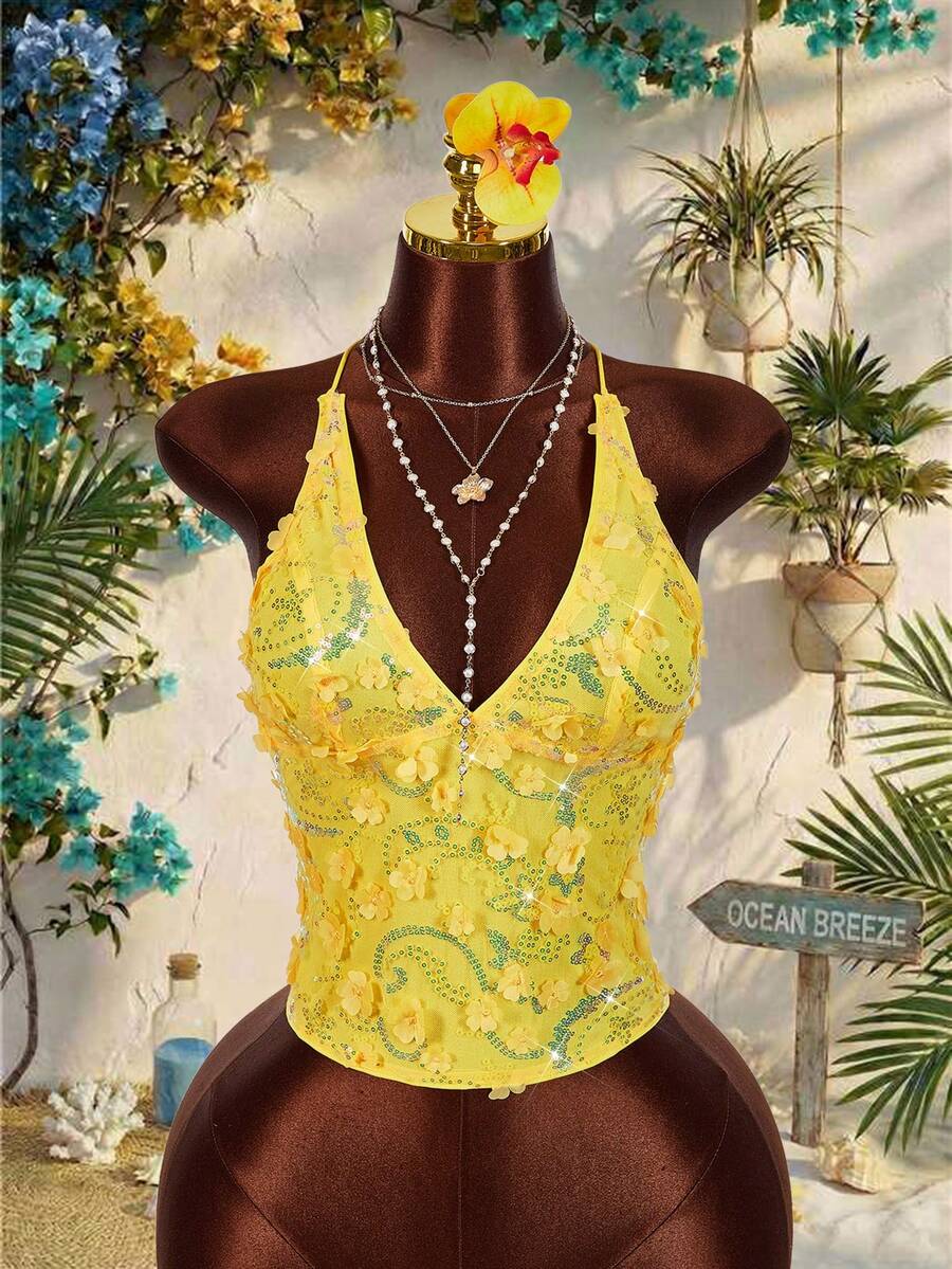 Women's embroidered sequin halter cami top featuring a deep V-neck, backless party design, and slim fit silhouette.