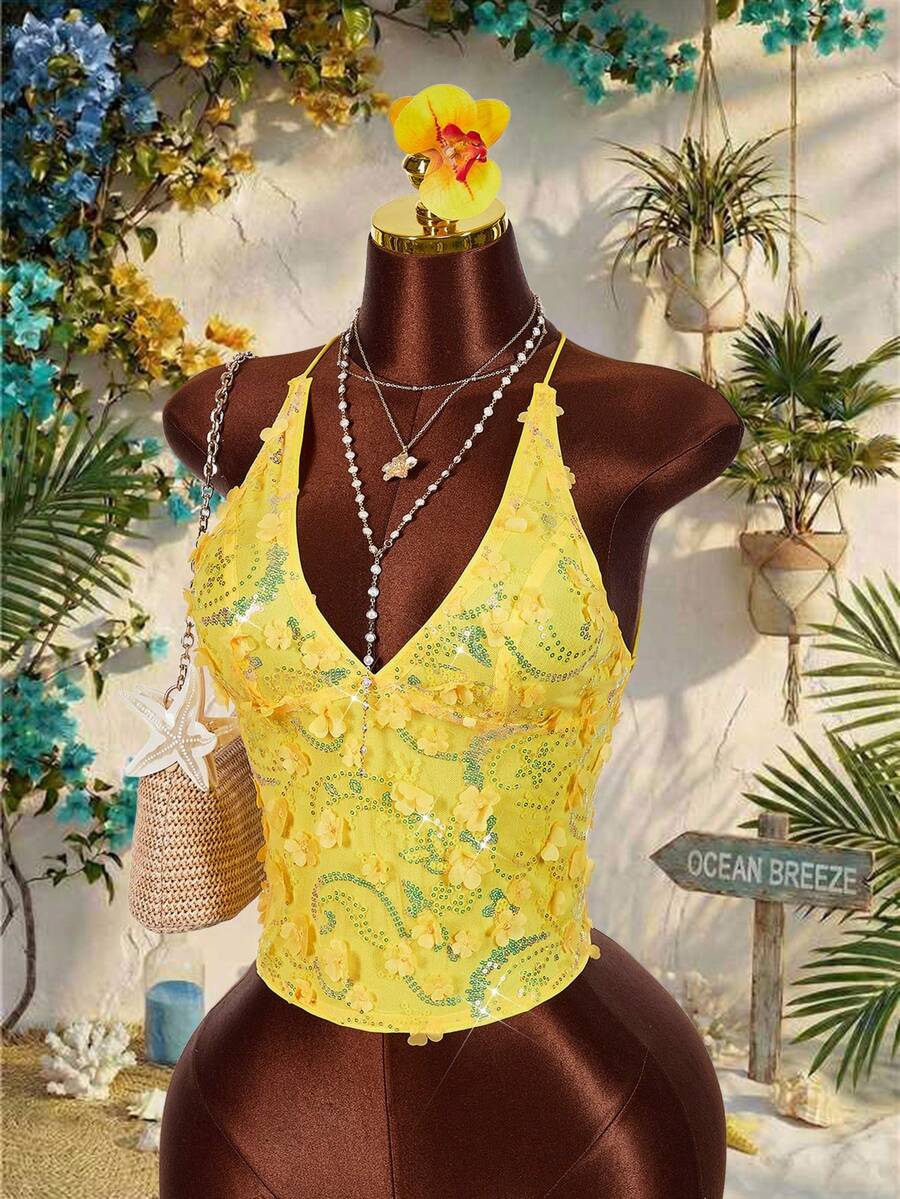 Women's embroidered sequin halter cami top featuring a deep V-neck, backless party design, and slim fit silhouette.