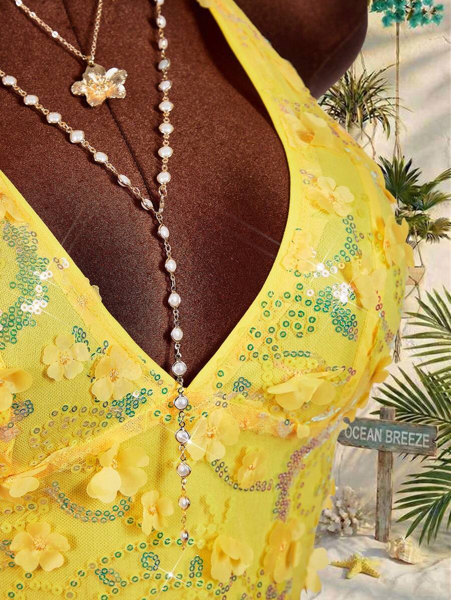 Women's embroidered sequin halter cami top featuring a deep V-neck, backless party design, and slim fit silhouette.