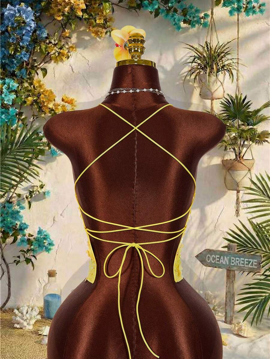 Women's embroidered sequin halter cami top featuring a deep V-neck, backless party design, and slim fit silhouette.