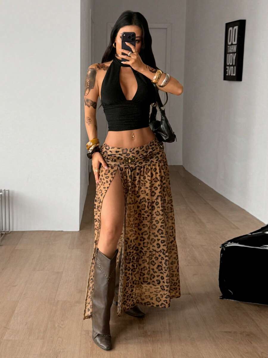 Women's low rise flared long skirt featuring an all-over print, split thigh accent, and textured semi-sheer fabric.