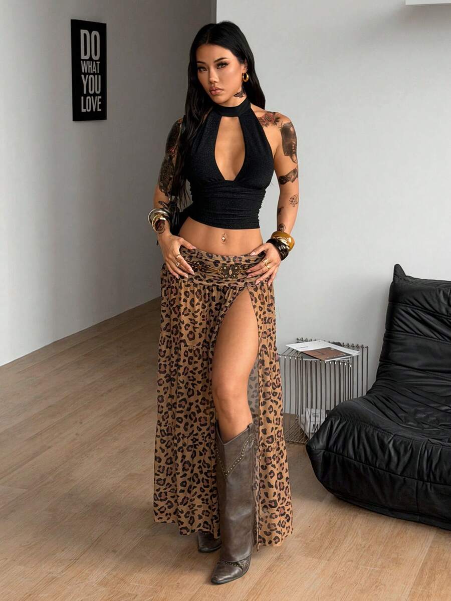 Women's low rise flared long skirt featuring an all-over print, split thigh accent, and textured semi-sheer fabric.