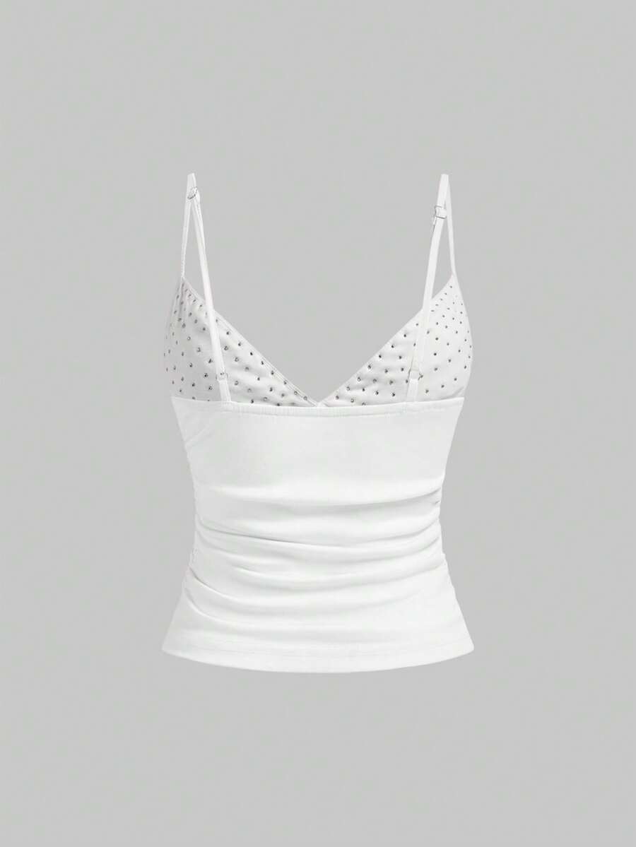 Women's slim fit sleeveless crop top featuring spaghetti straps, ruched detailing, and studded rhinestone accents.