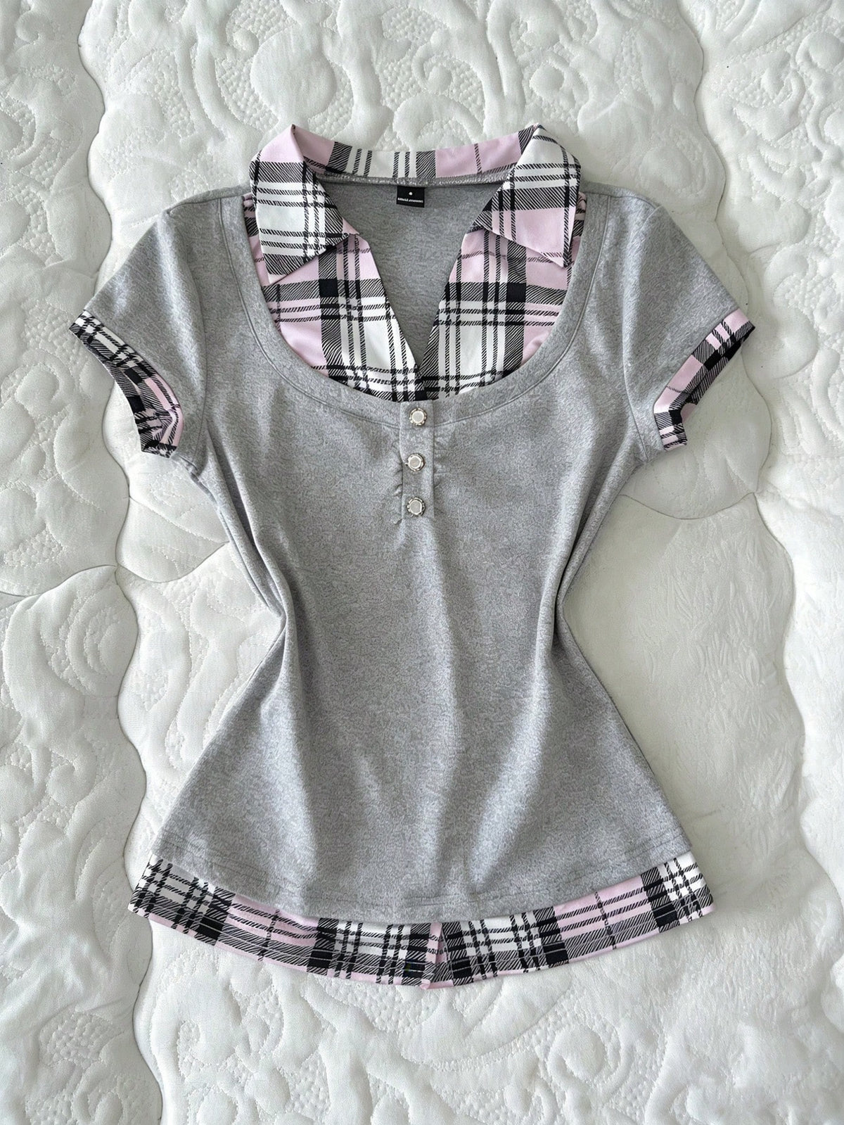 Women's black short sleeve slim fit 2-in-1 t-shirt with a plaid patchwork shirt collar detail.