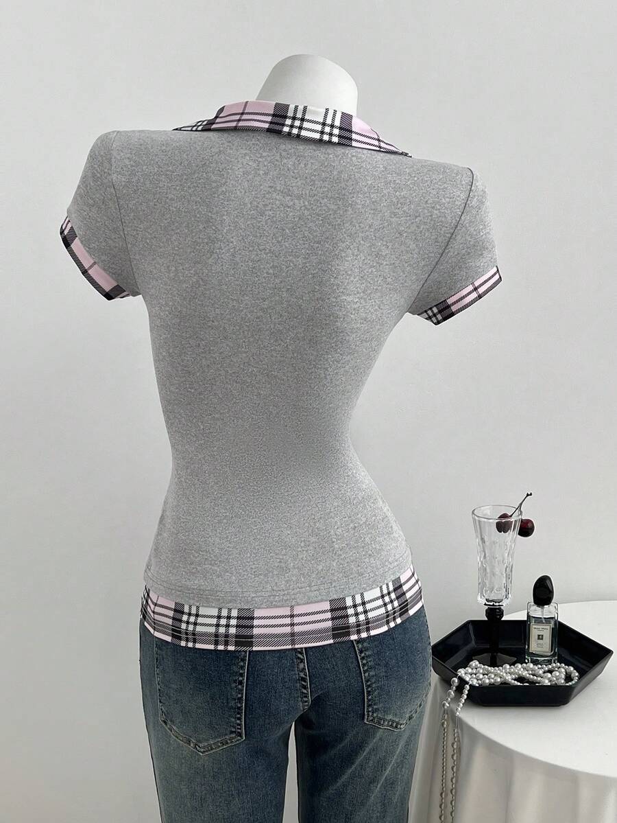 Women's black short sleeve slim fit 2-in-1 t-shirt with a plaid patchwork shirt collar detail.