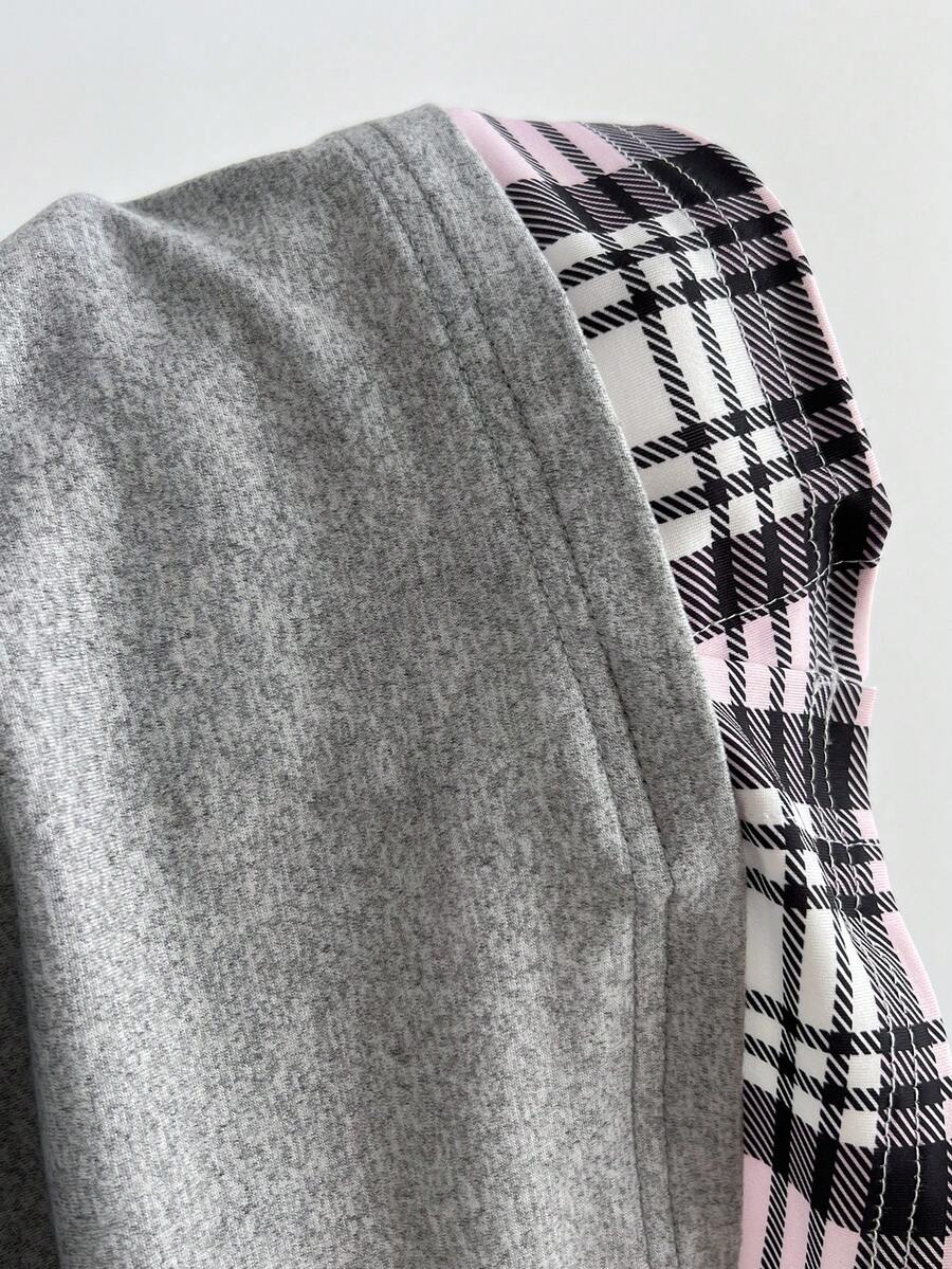 Women's black short sleeve slim fit 2-in-1 t-shirt with a plaid patchwork shirt collar detail.
