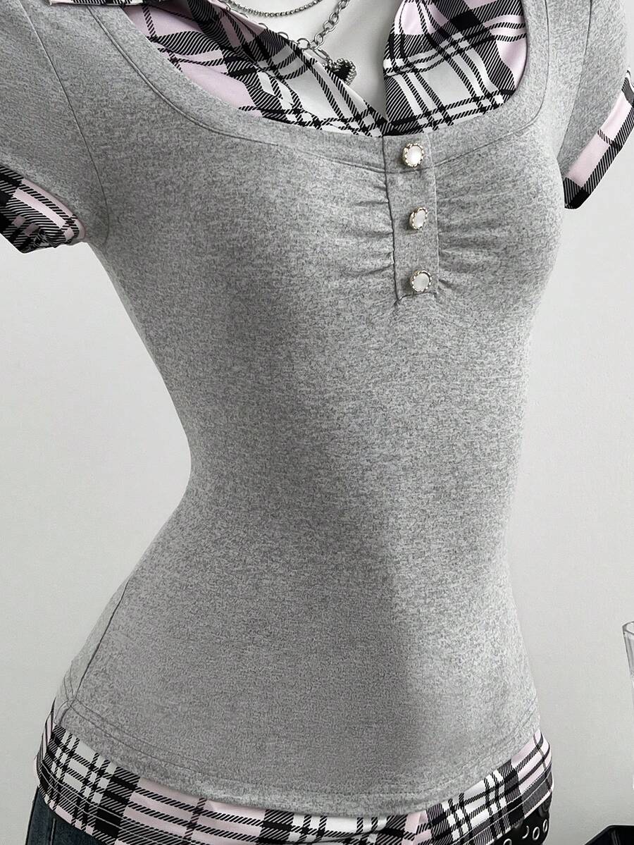 Women's black short sleeve slim fit 2-in-1 t-shirt with a plaid patchwork shirt collar detail.
