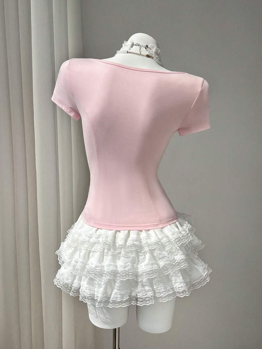 Women's pink short sleeve slim fit dress featuring a plant pattern, scoop neck, ruched appliques, and button front detail.