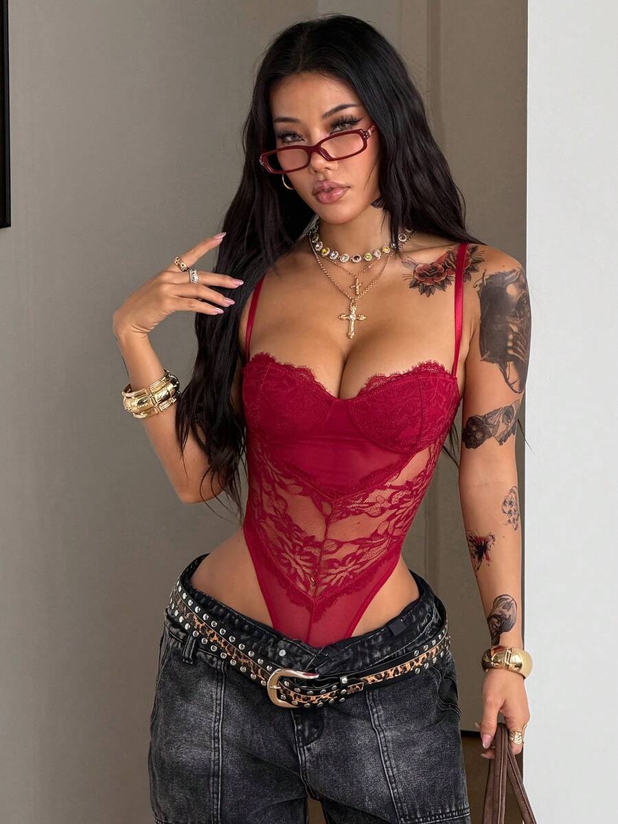 Fitted women's lace and mesh cami bodysuit with spaghetti straps.