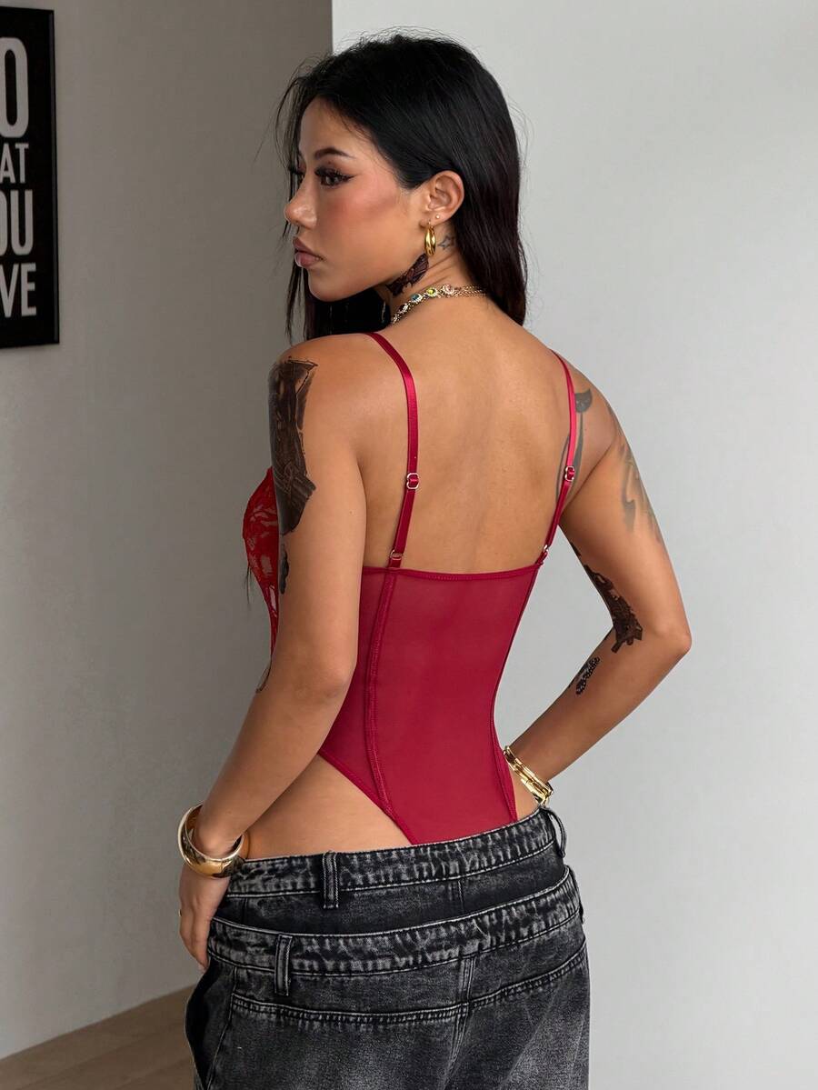 Fitted women's lace and mesh cami bodysuit with spaghetti straps.