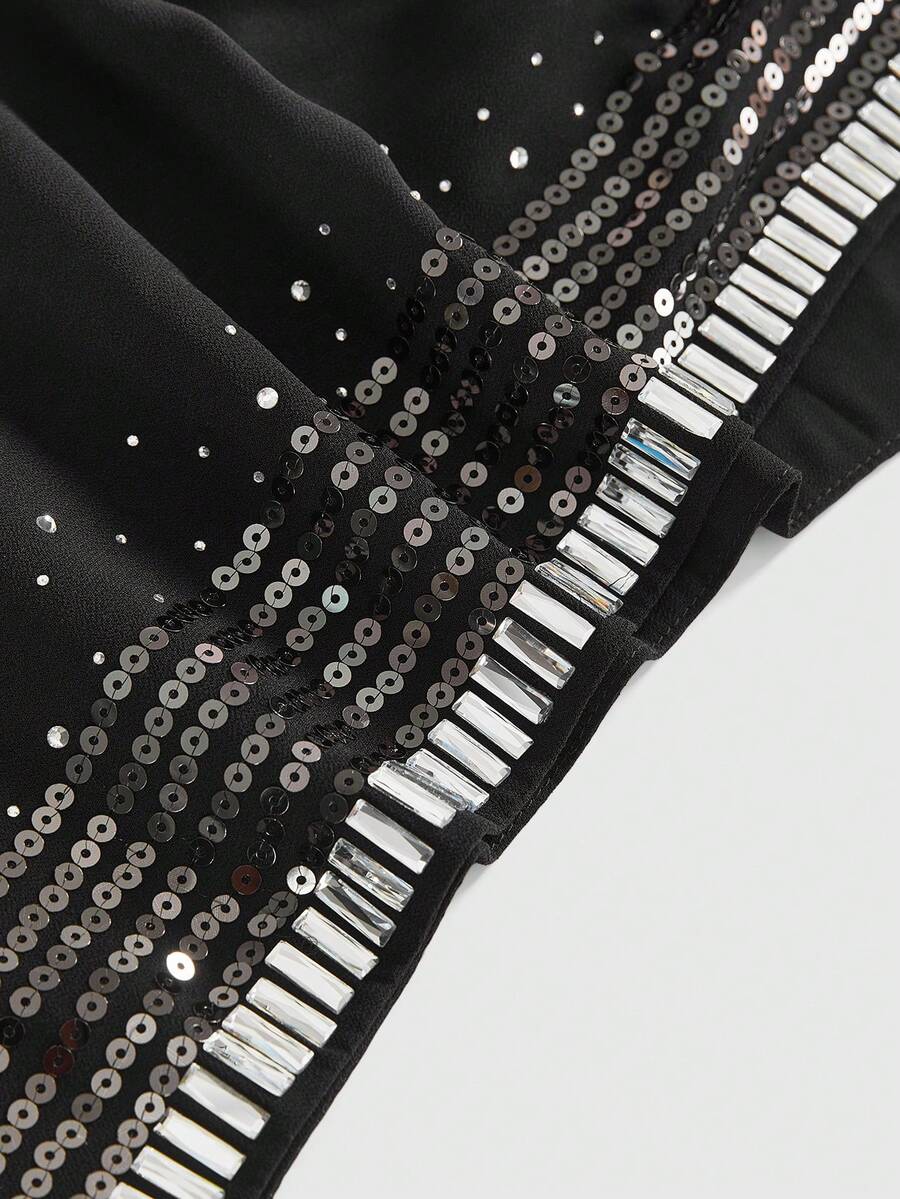 Women's draped neck backless halter crop tank top with studded details, letter pattern, semi-sheer chiffon fabric, and slim fit party style