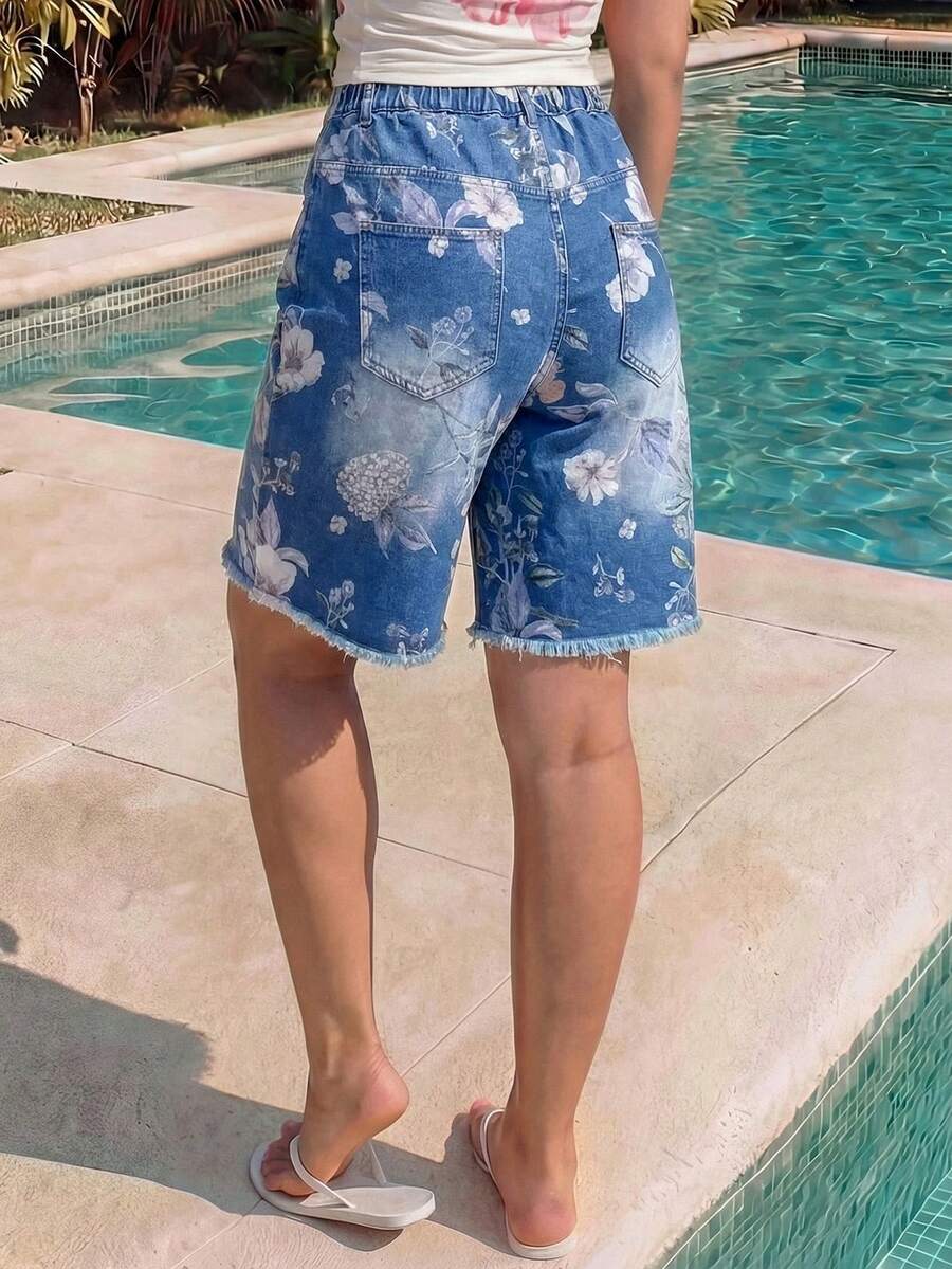 Women's loose wide-leg denim Bermuda shorts featuring vintage animal and paisley print with pockets and zipper fly.