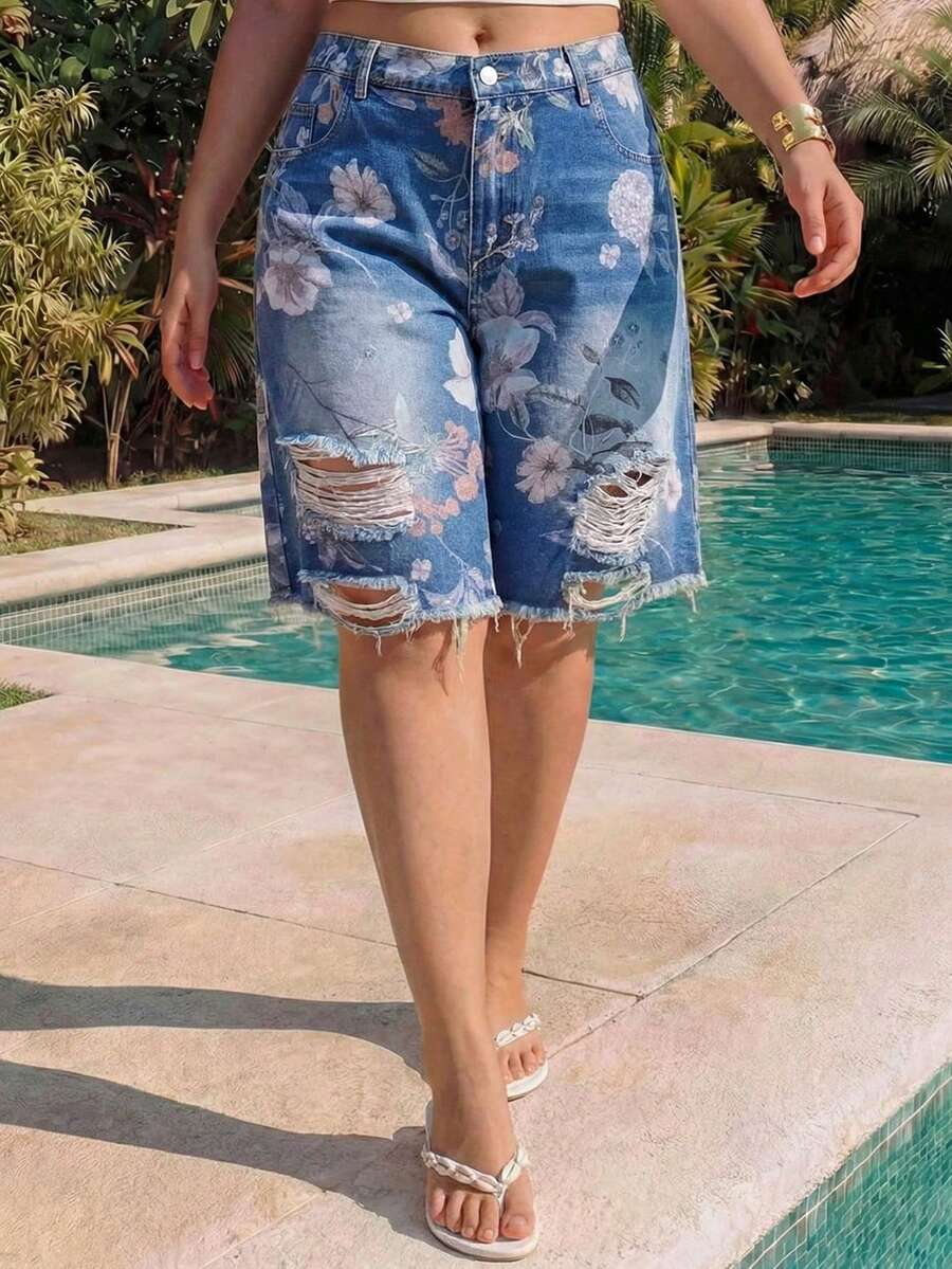 Women's loose wide-leg denim Bermuda shorts featuring vintage animal and paisley print with pockets and zipper fly.