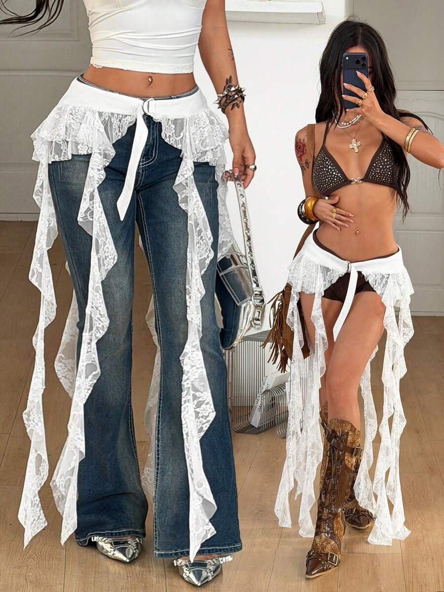 Women's black semi-sheer lace asymmetrical skirt with fringe details, contrast lace, low waist, and ruffle hem for beach, party, concert, or festival outfits.